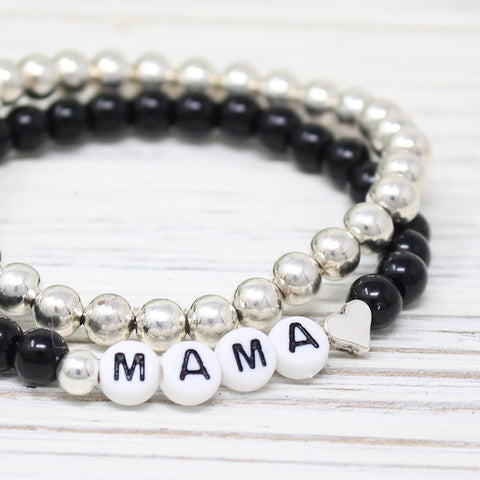 products/Mamaheartblackbeadbracelet_closeup.jpg